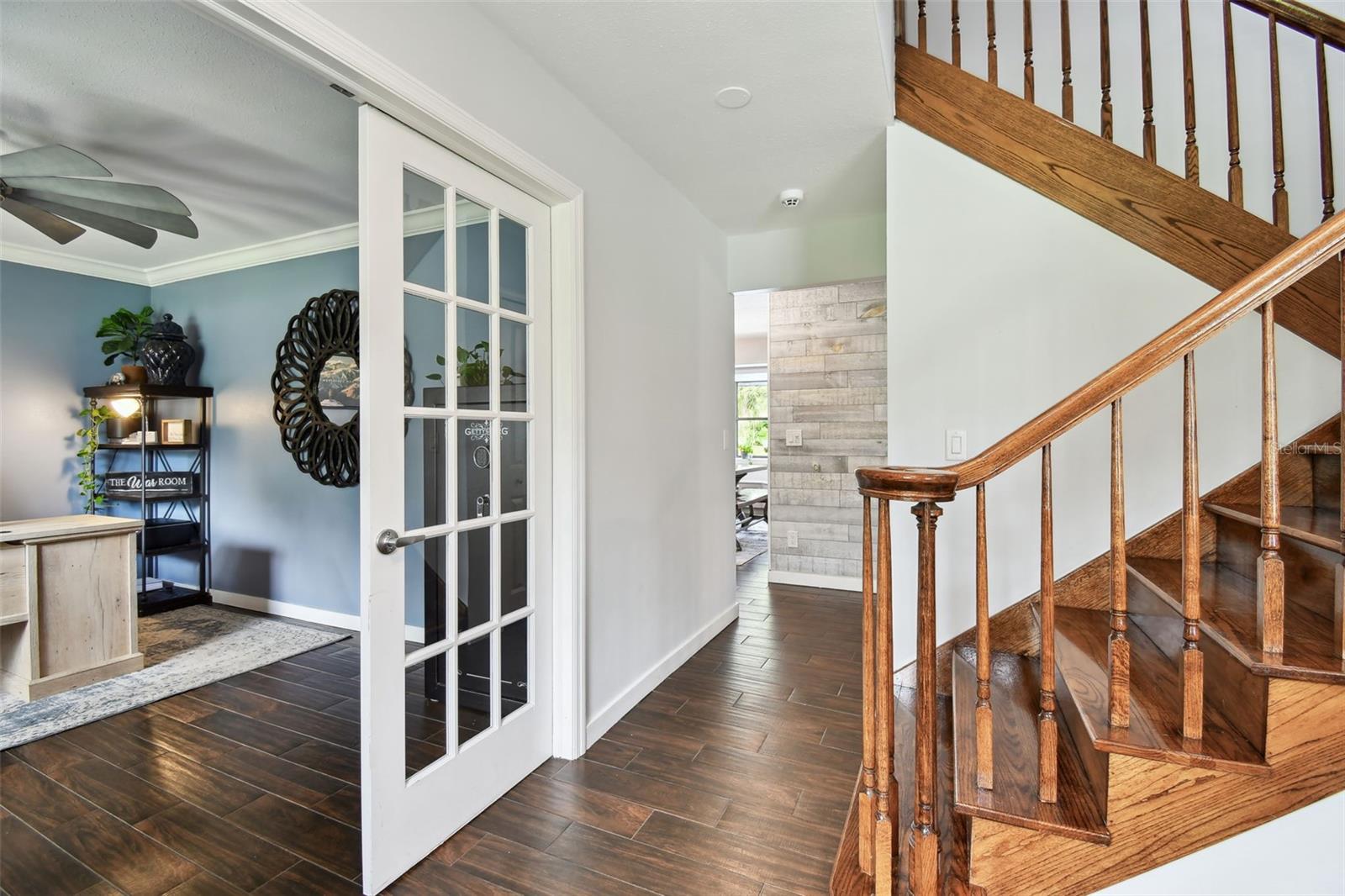 French doors for when privacy is needed. Beautiful faux wood tile.
