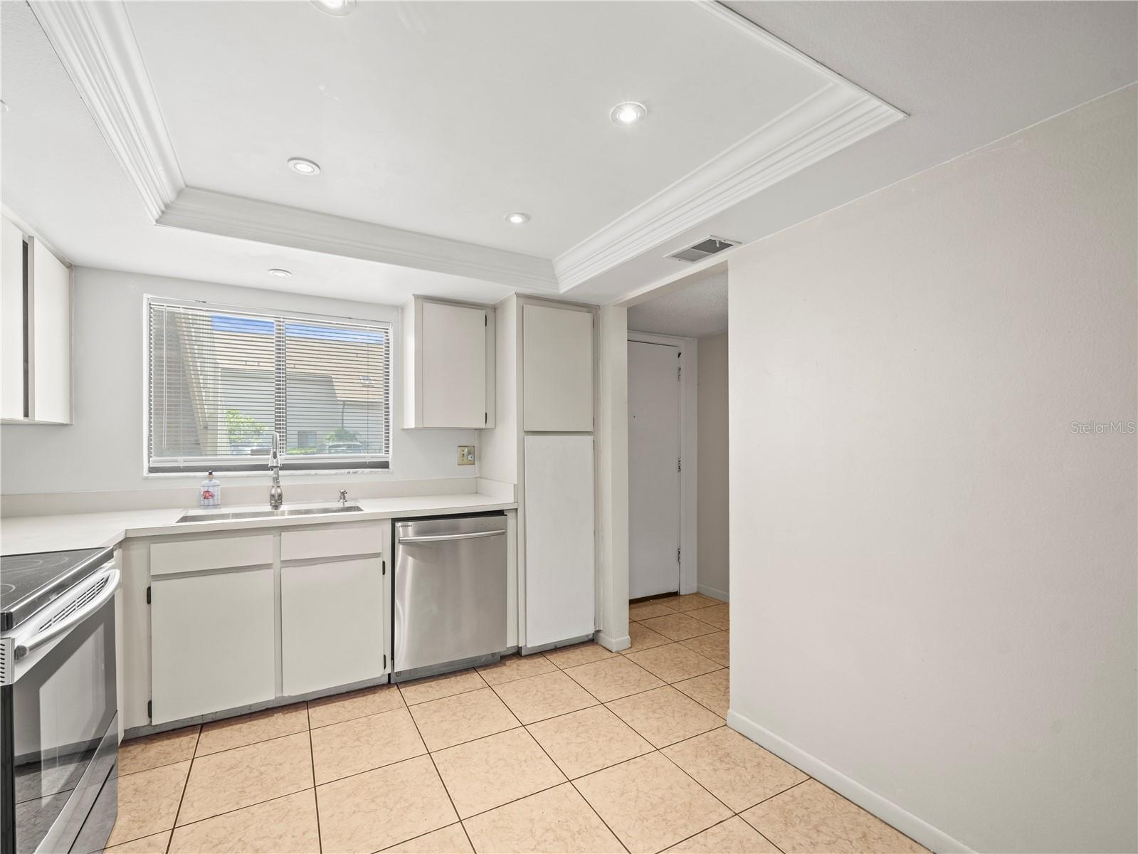 Kitchen view towards foyer and entry