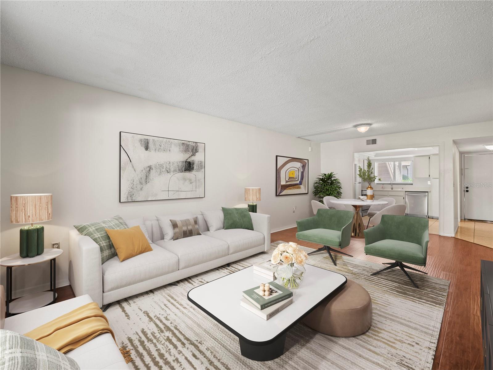 Staged view toward kitchen and entry foyer