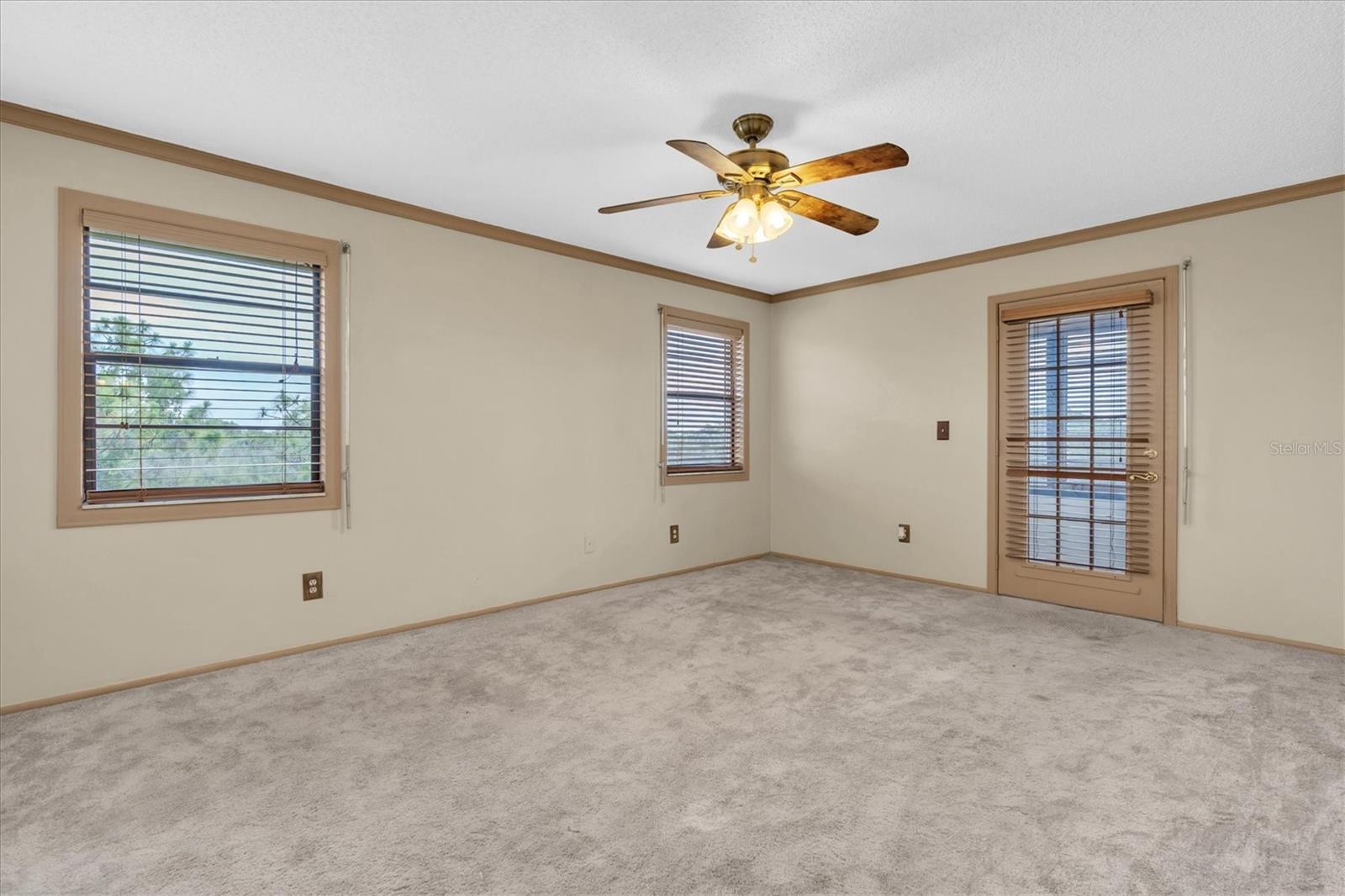 Primary bedroom with an additional enclosed patio