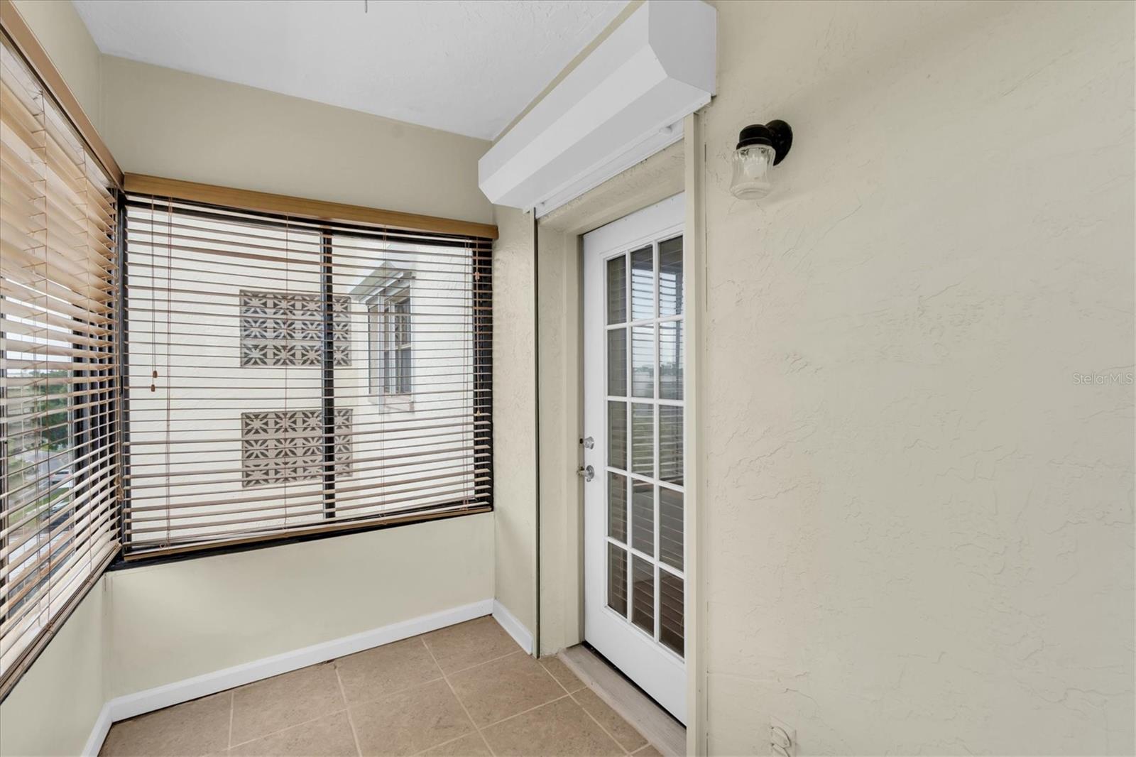 Enclosed patio off of the primary bedroom