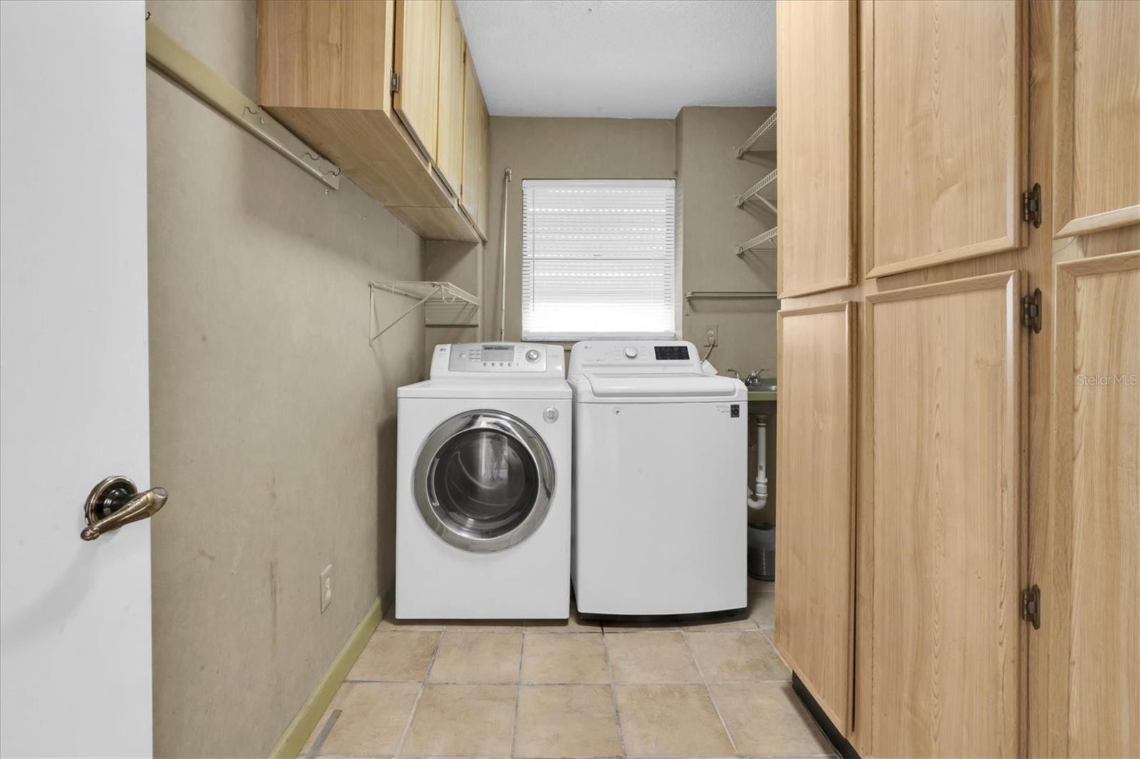 Full size laundry room located off of the kitchen area