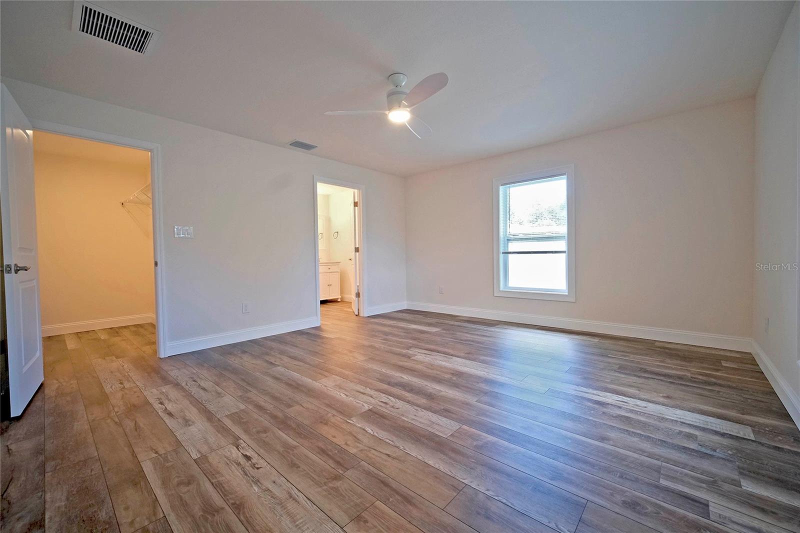 Primary Bedroom with on-suite bathroom and large walk-in closet.