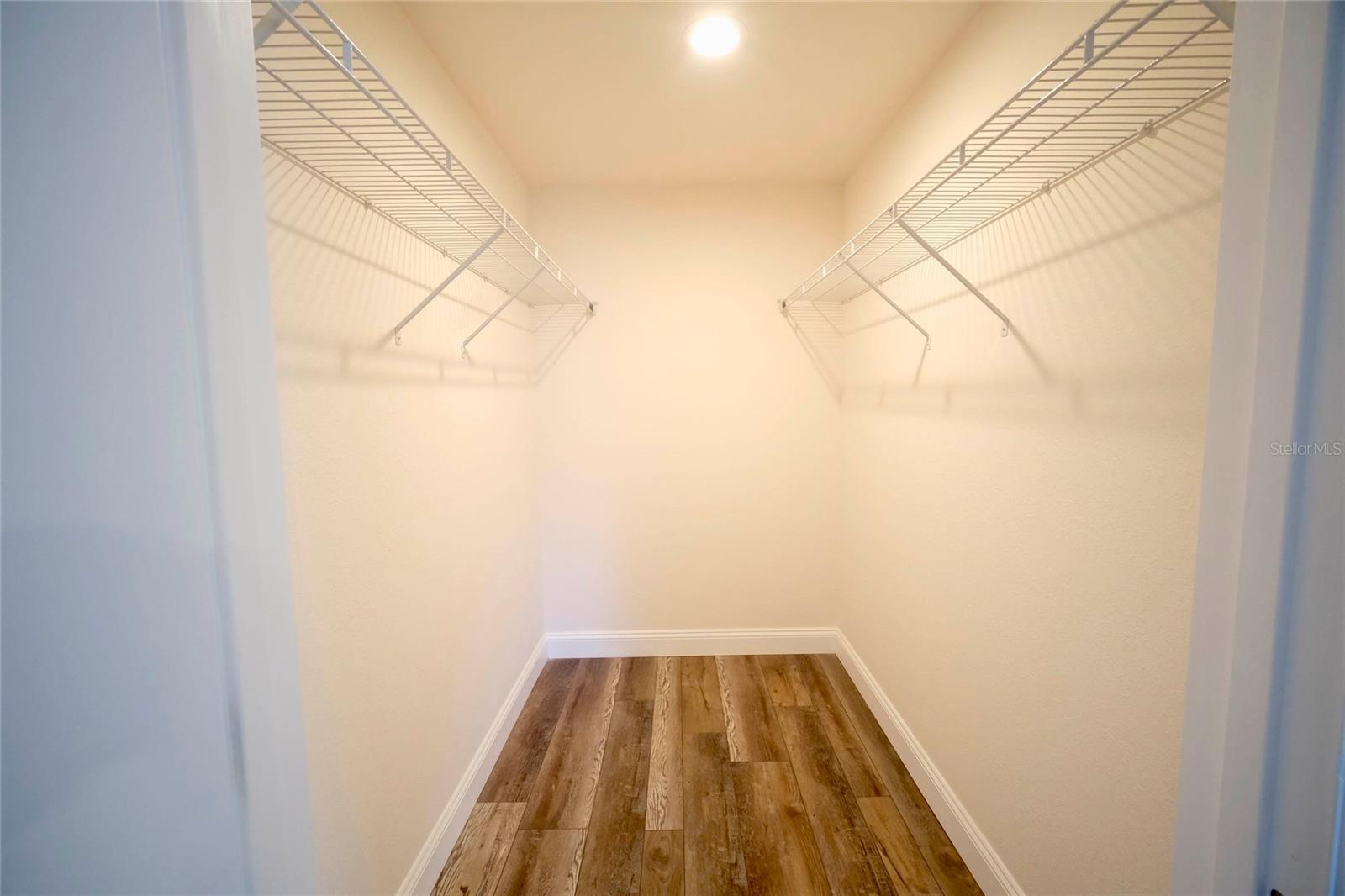 Primary Bedroom walk-in closet.