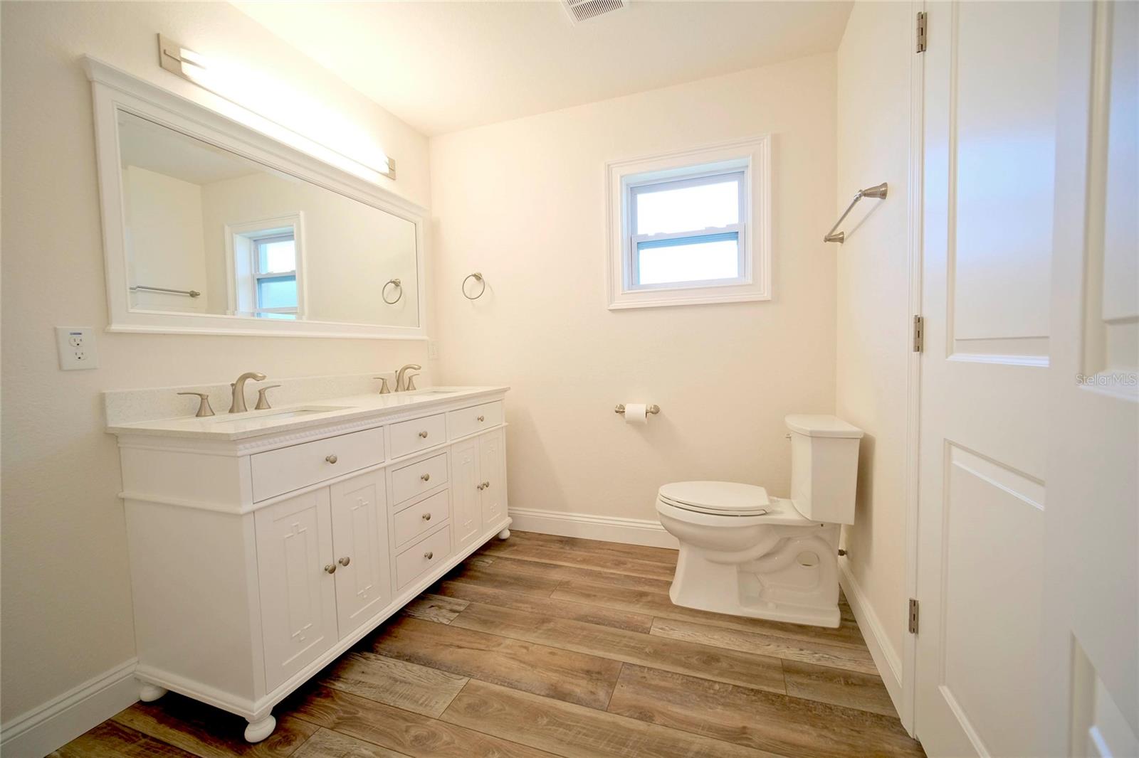 Primary Bathroom with dual vanities.