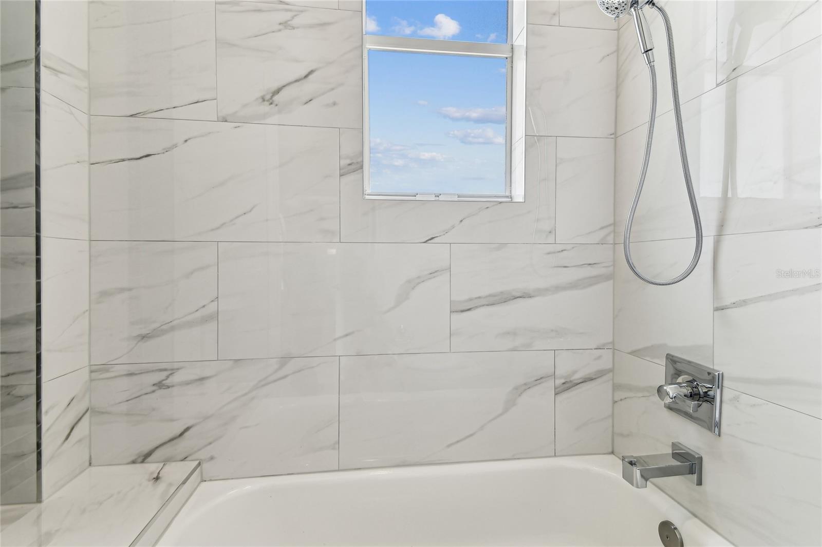 Full bathroom off the garage/kitchen