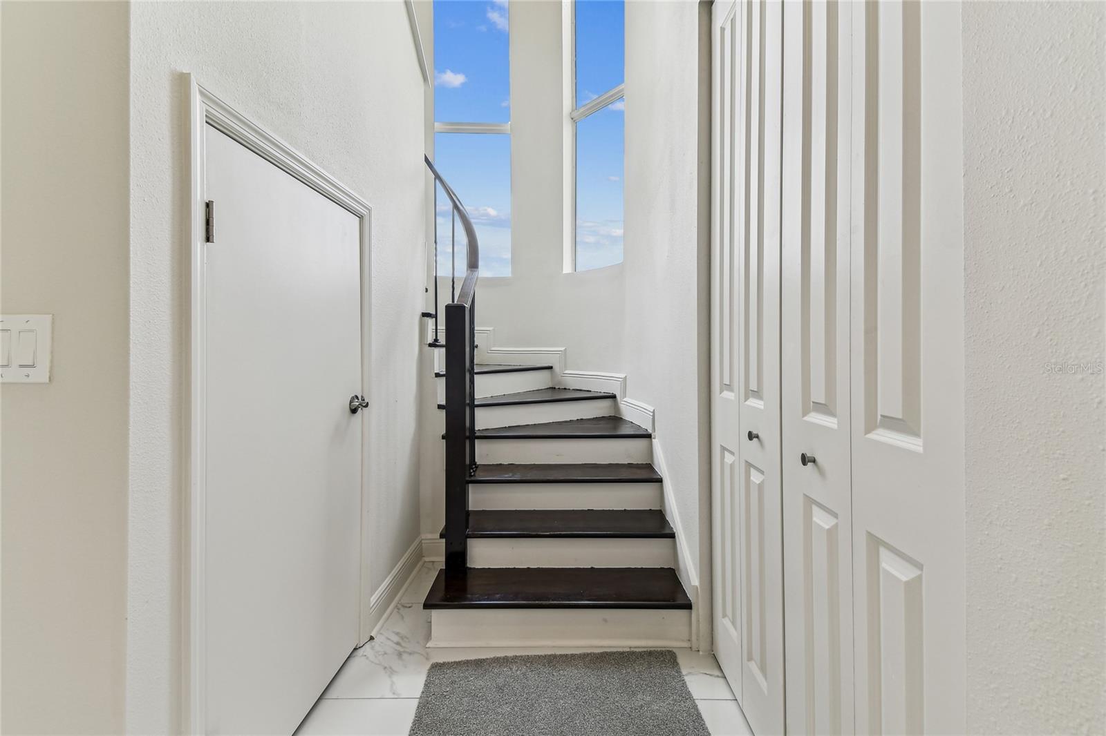 Curved staircase with storage underneath