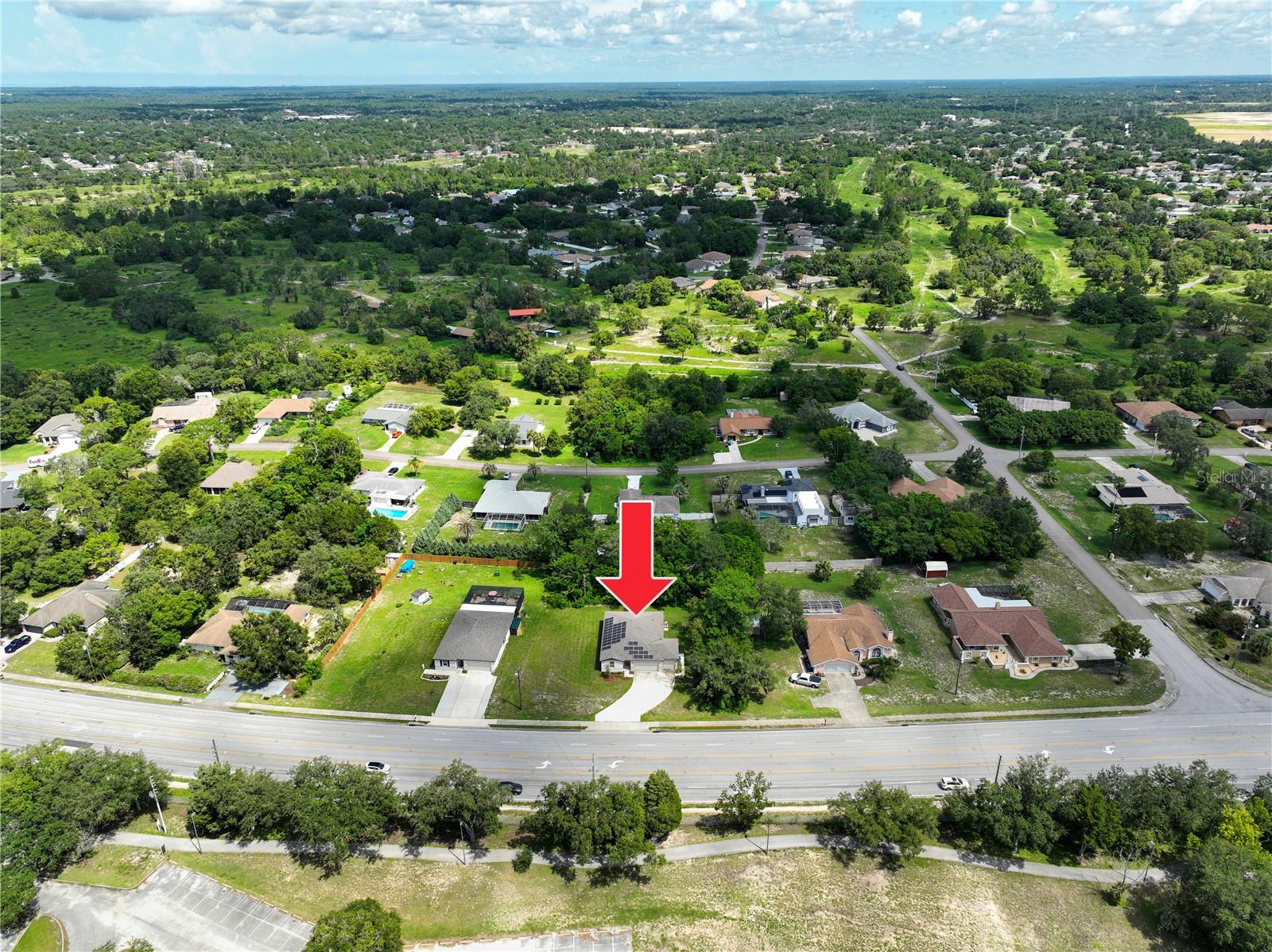 Aerial Overview of Home and Solar Panels