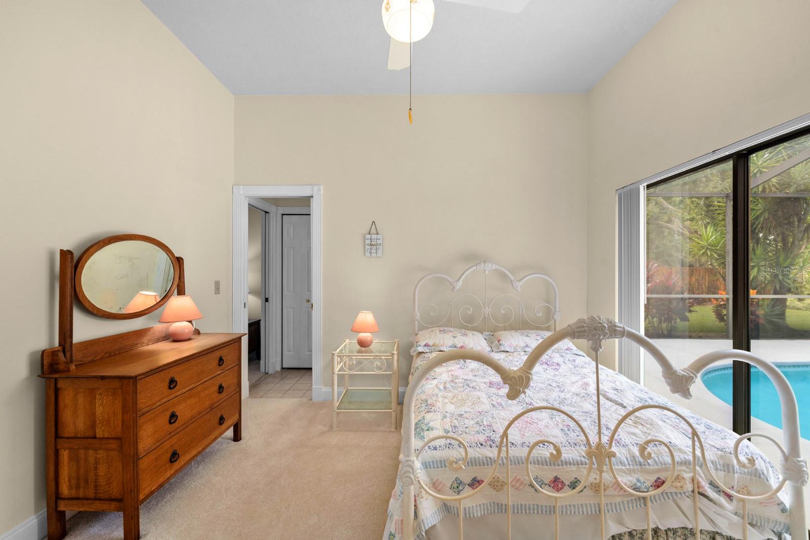 Bedroom 2 has a slider that goes to the lanai, plus a jack-n-jill bathroom that is shared with bedroom 3.
