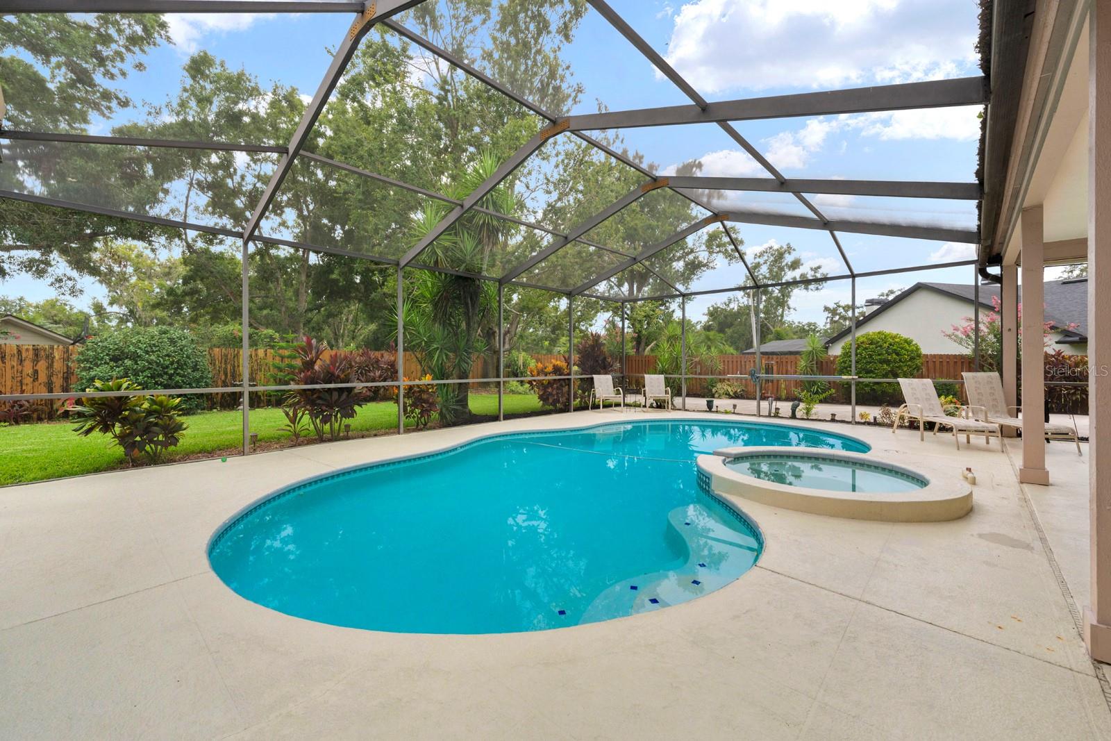 The humongous screened-in lanai is awesome for entertaining, especially with the living room pocket doors that open up all the way.  Sit in the jacuzzi and watch the sunset each evening in the West.