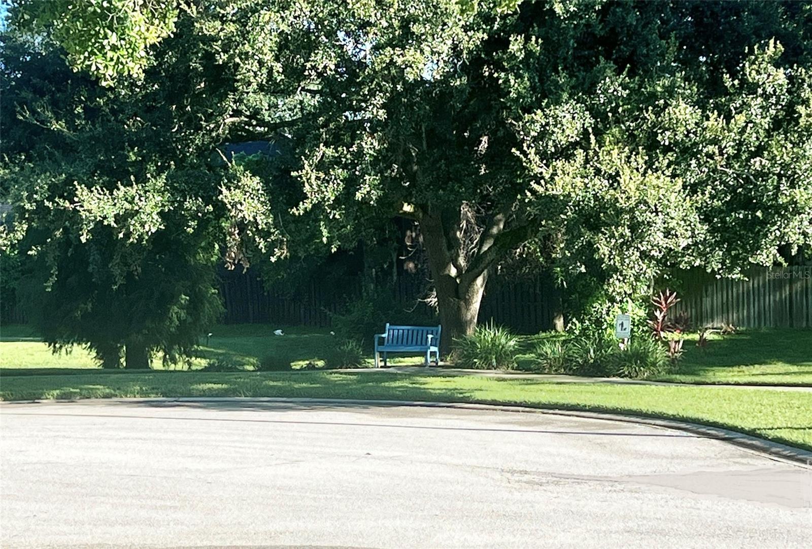 On the cul-de-sac sits a bench in the shade for neighbors to enjoy, built and donated by the seller.