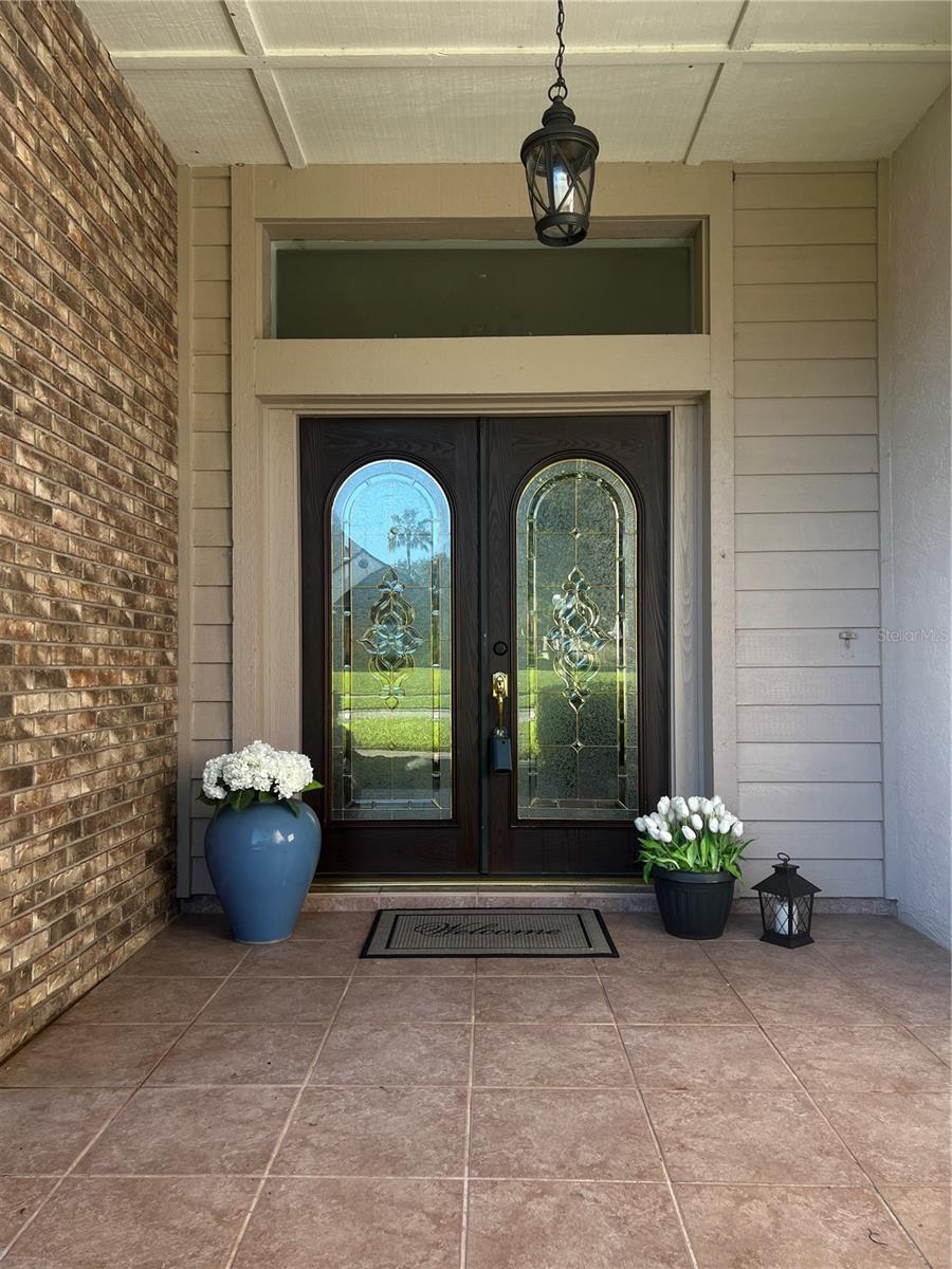 A very welcoming, double-door entry front porch!