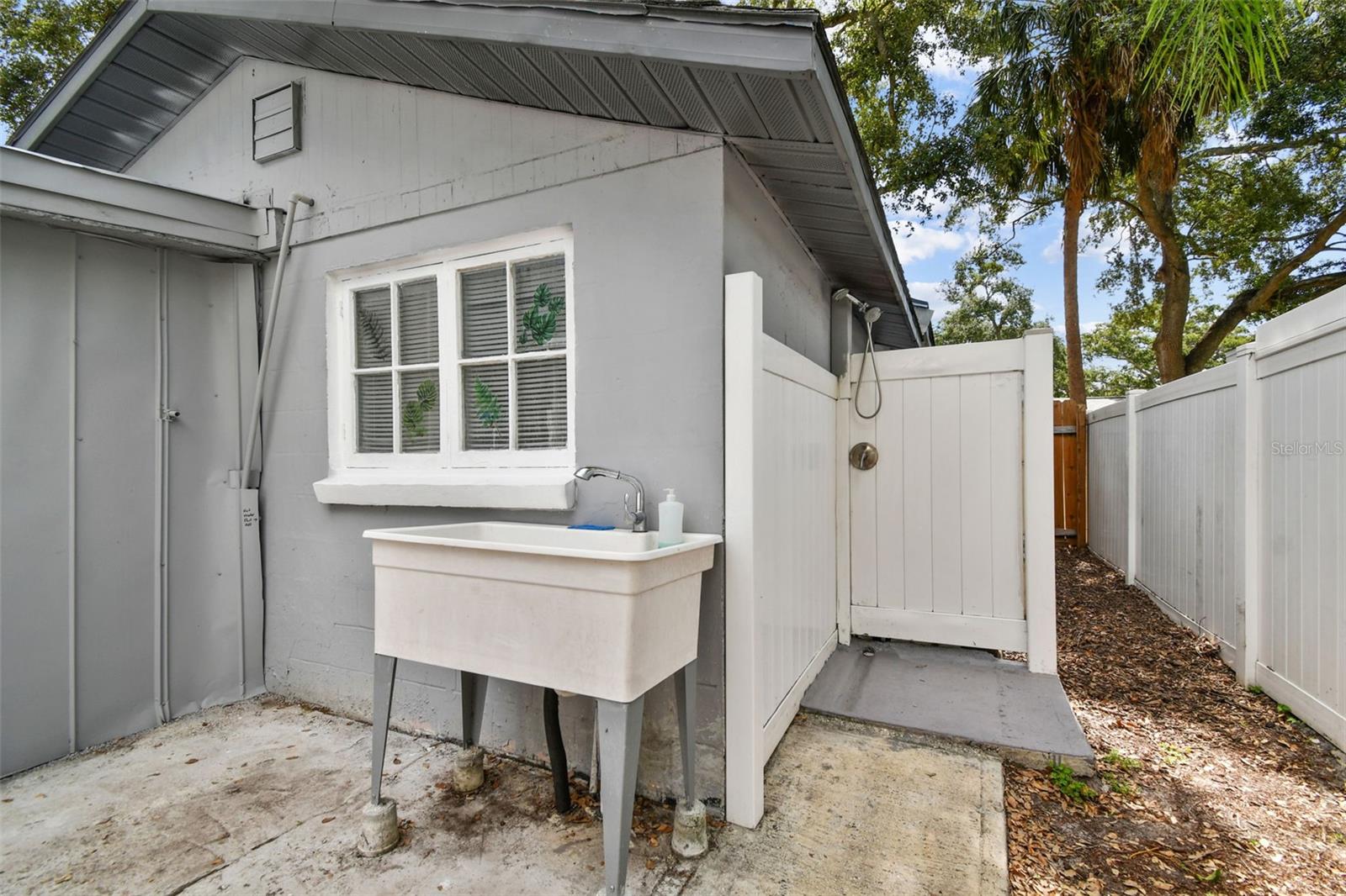 Outdoor shower & utility sink with hot & cold water
