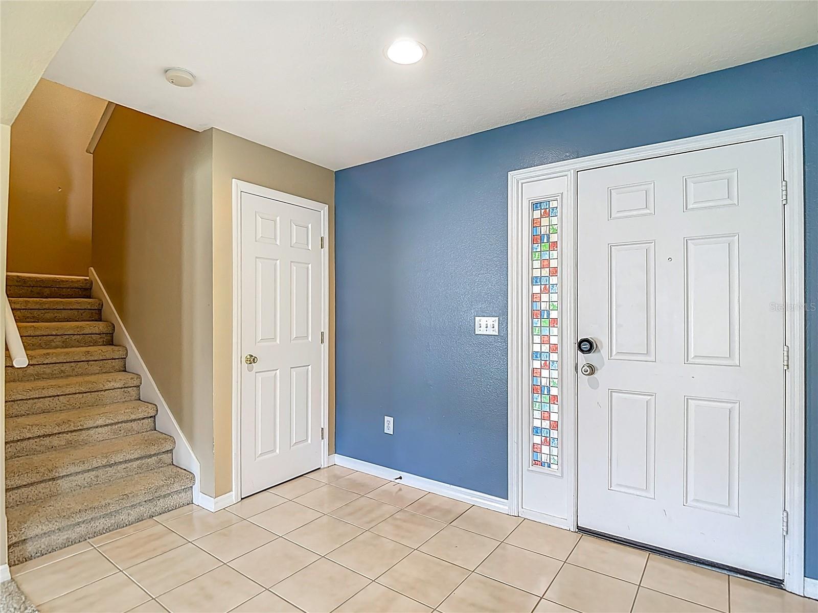 Coat closet and stairs to 2nd Floor
