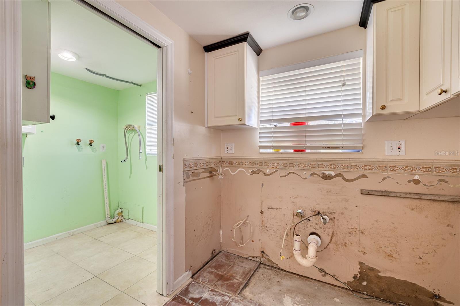Kitchen open to laundry