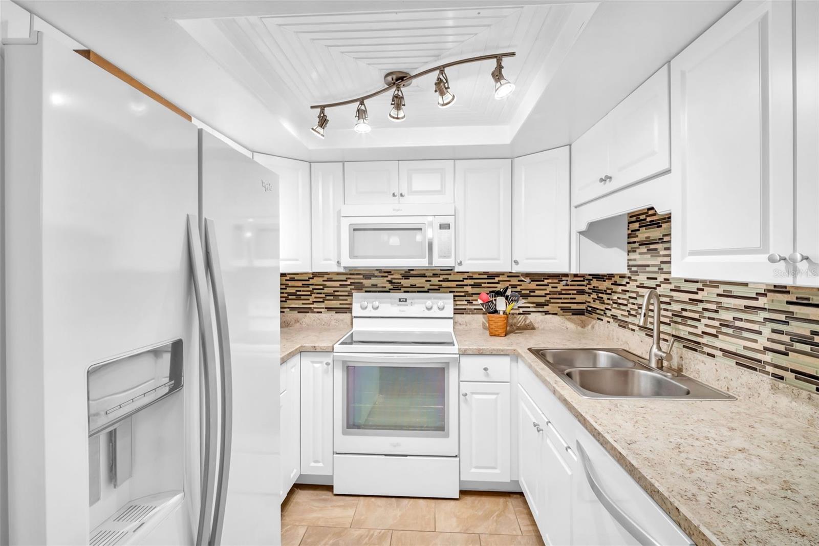 Updated solid wood cabinetry, countertops, appliances & sleek lighting~