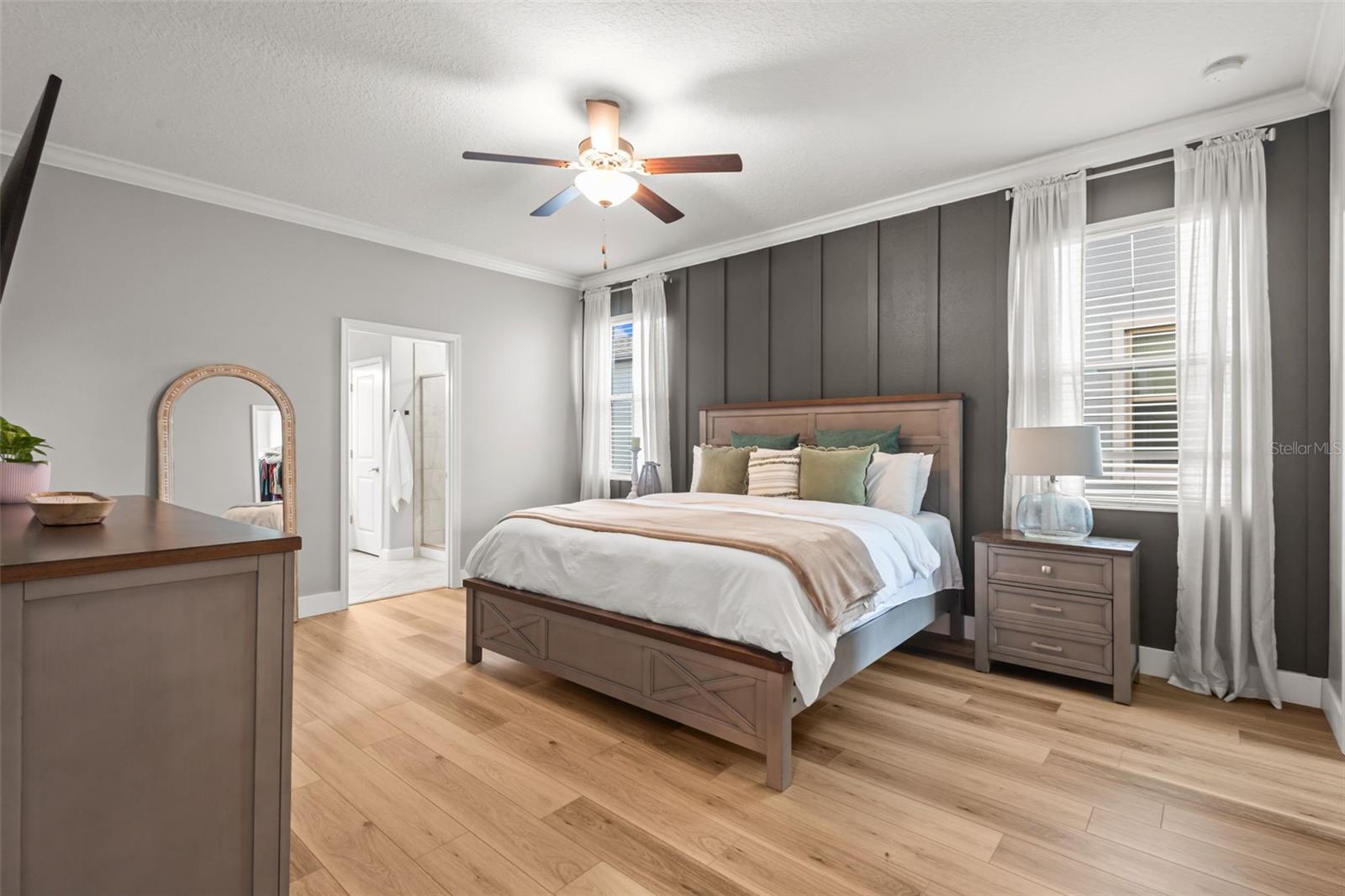 Primary suite on first floor in front of the home, has 2 closets