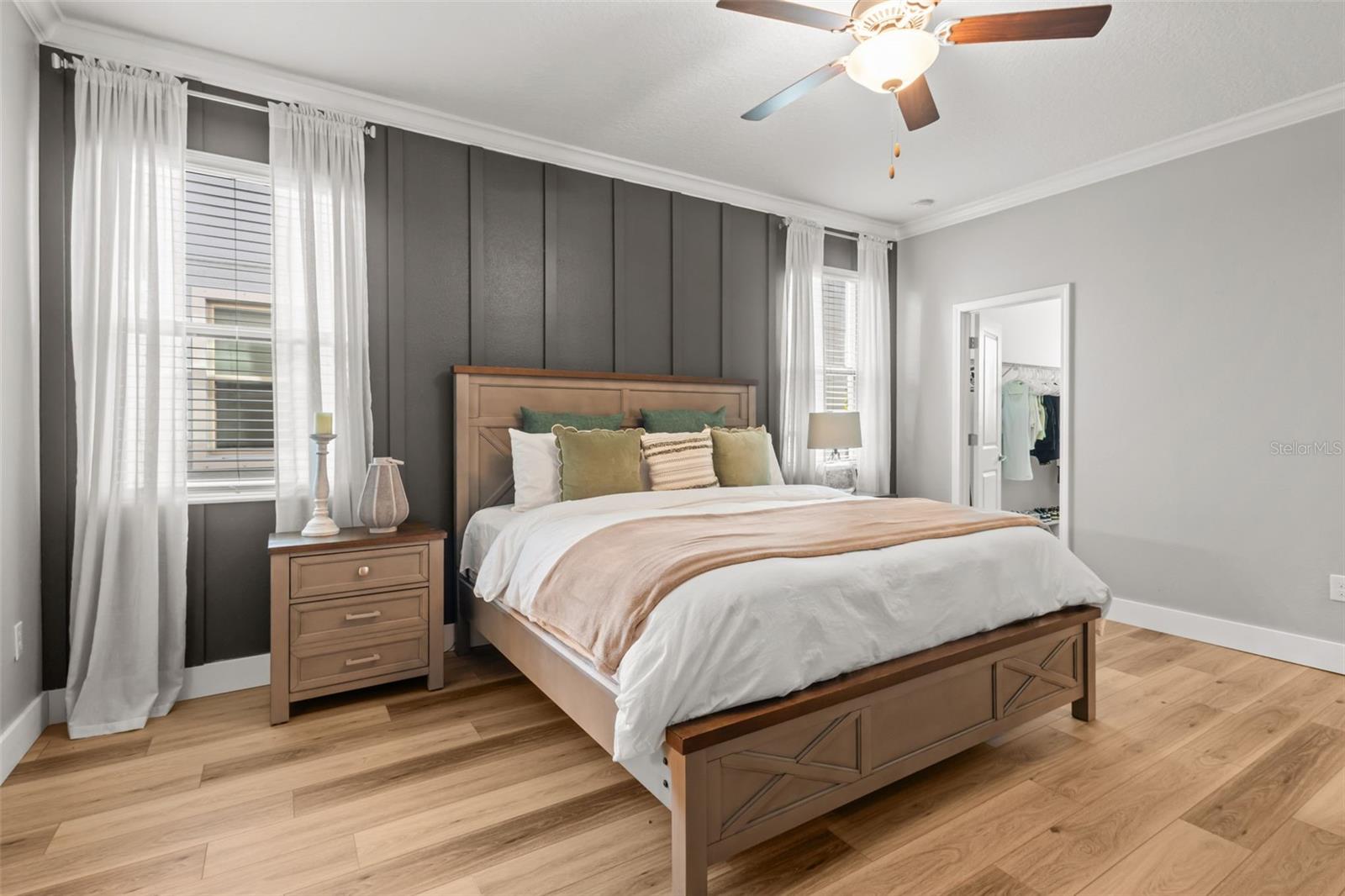 Primary Bedroom on first floor with custom woodworking and 2 closets (1 walk in)