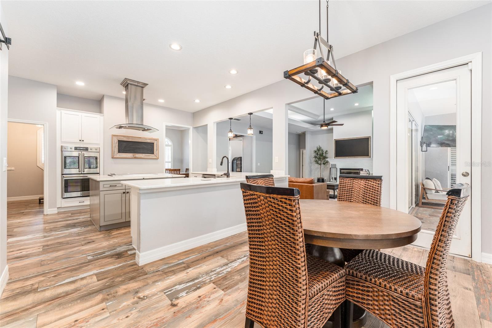 Dining Area Adjacent to Kitchen that overlooks Beautiful Outdoor Living Space