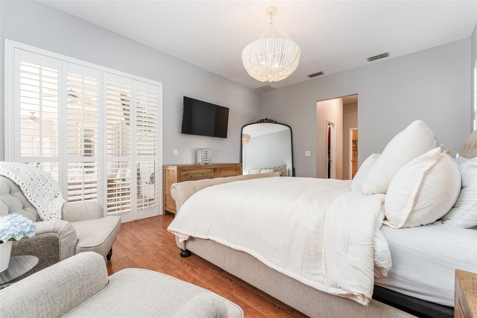Primary Suite with 2 Walk in Closets & Sliders to Outdoor Living Area
