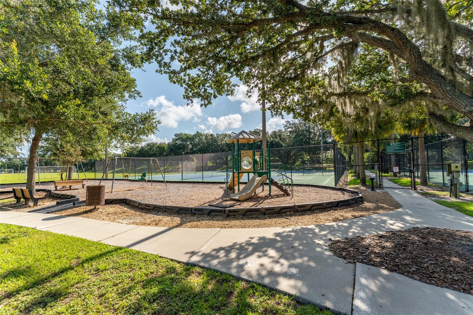 Another Playground with Tennis Courts Behind