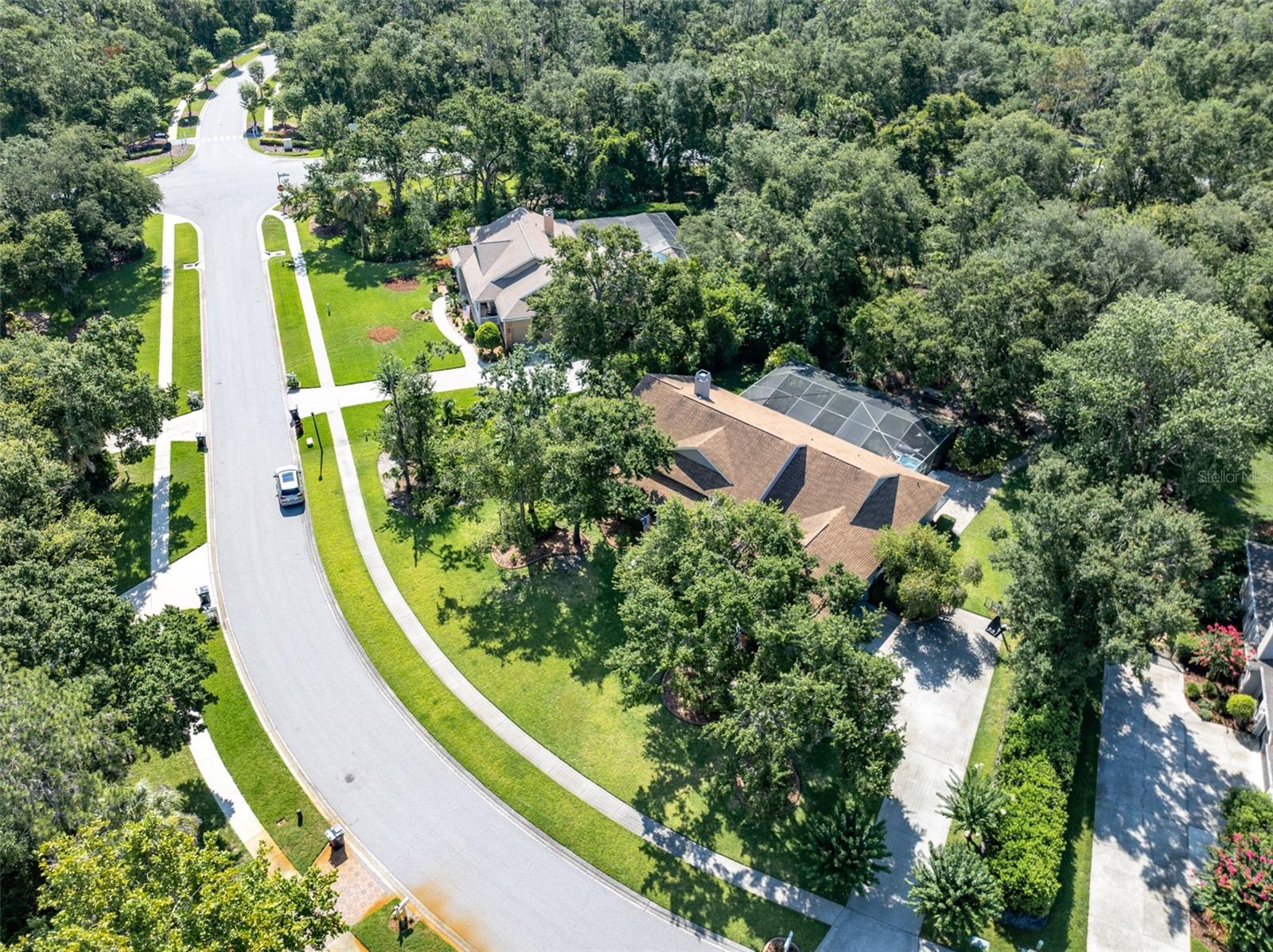 Aerial of Home on Private, Wooded Almost 3/4 Acre Conservation Lot