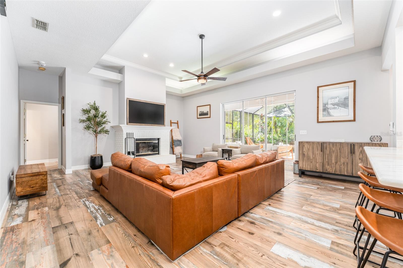 Expansive Great Room with Access to Outdoor Living Space Through Triple Inset Paned Sliders That Pocket Open Completely Expanding Your Living Space
