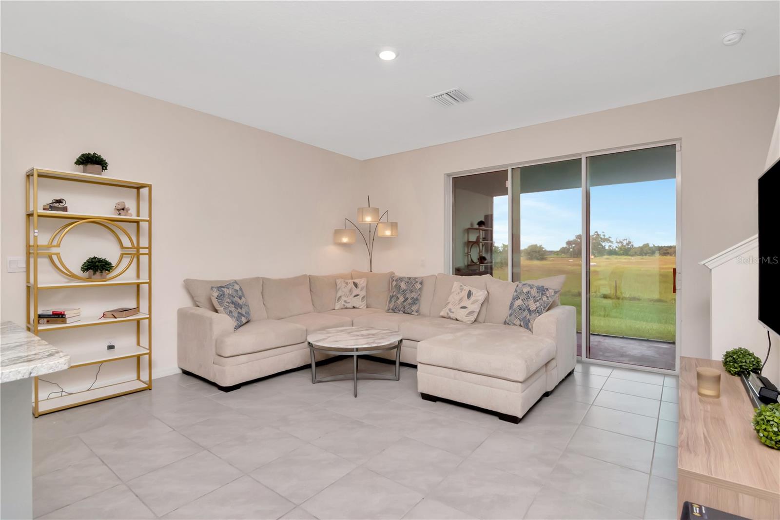 Open Concept - Livingroom with private views and triple sliders