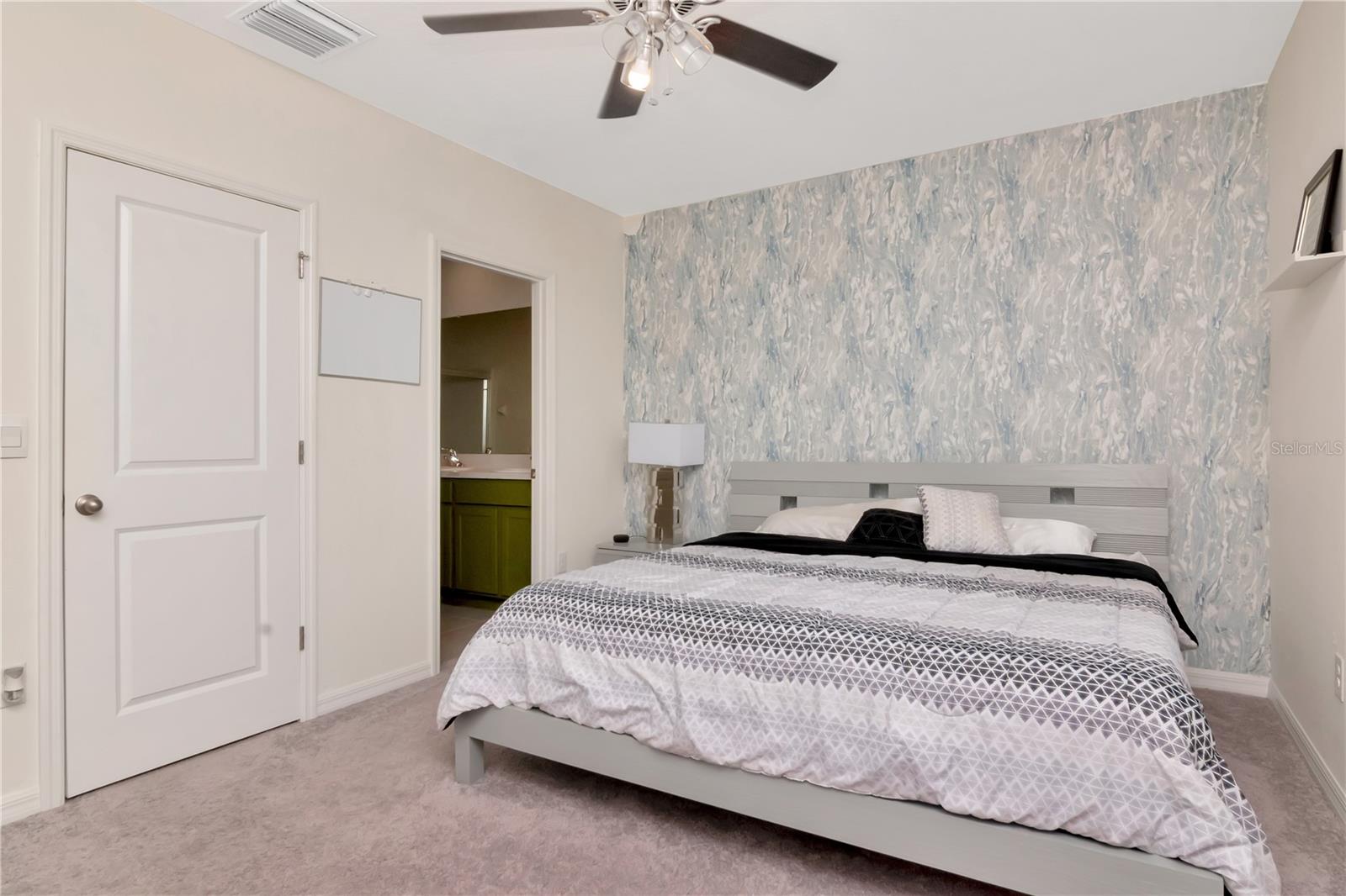 Spacious Primary Bedroom with Accent Wall