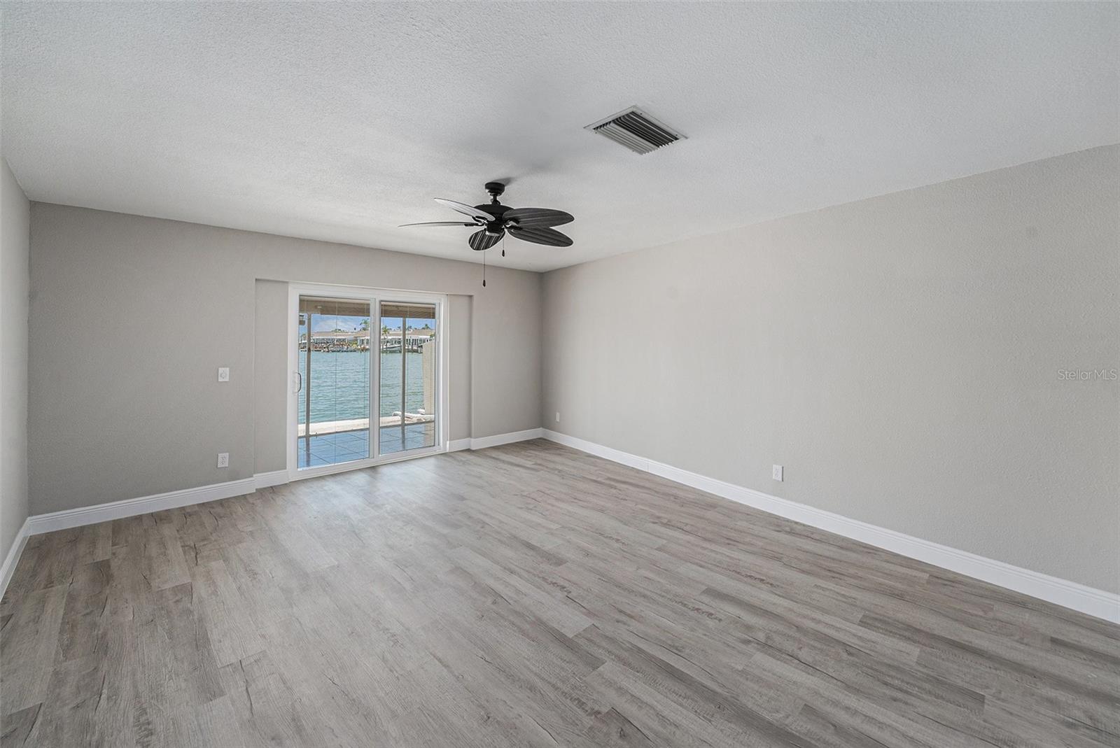 Primary Bedroom with Access to Florida room, Patio & Dock