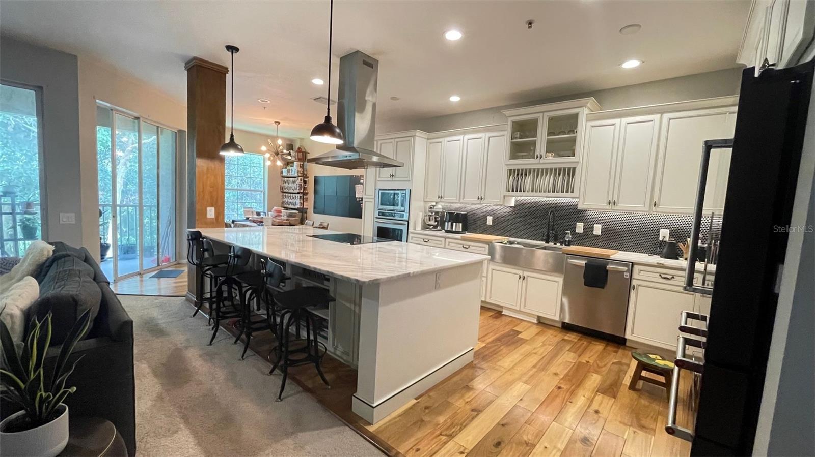Stunning kitchen with beautiful, custom cabinets, and a stunning quartz island.