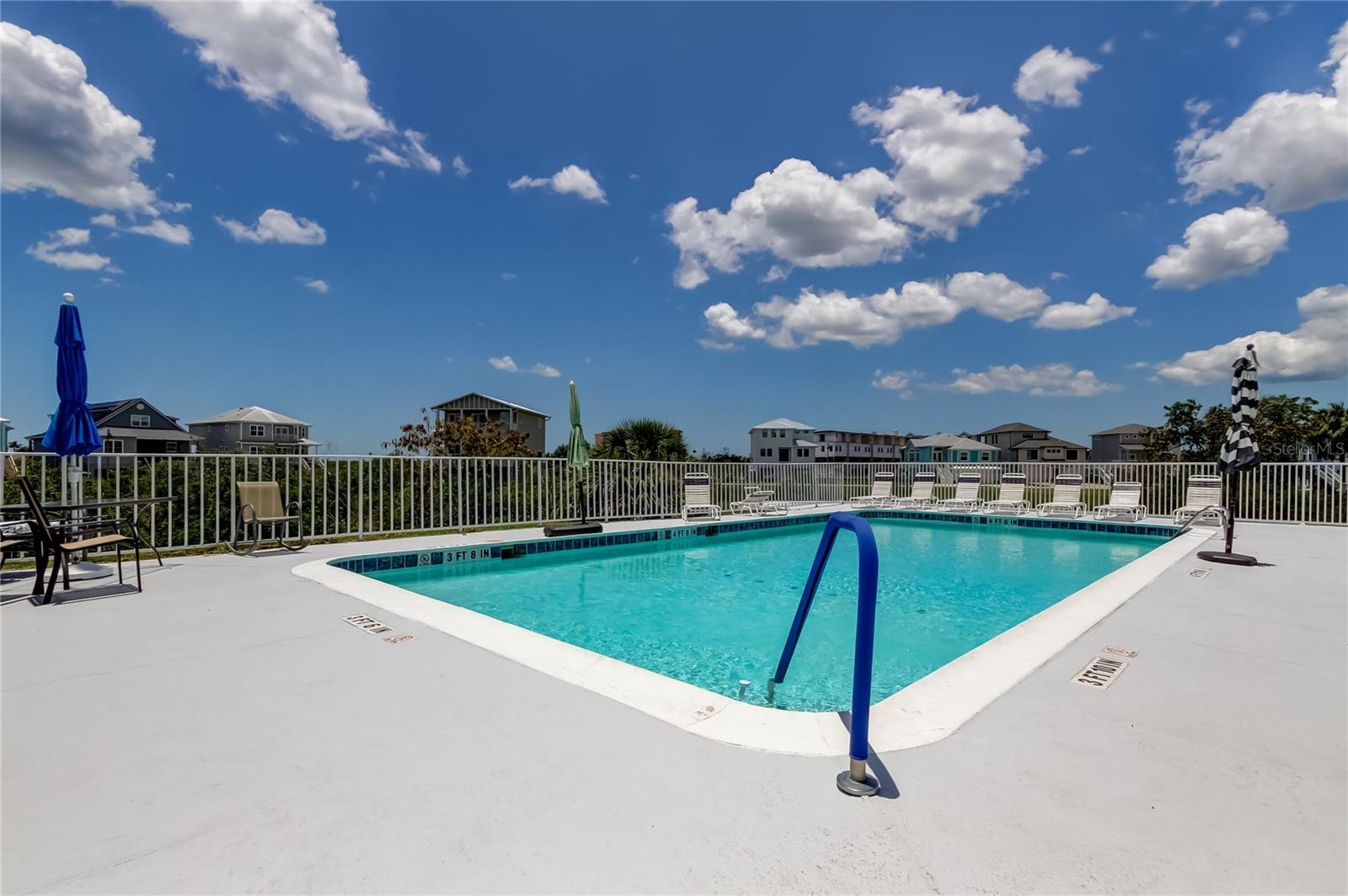 community pool steps from condo