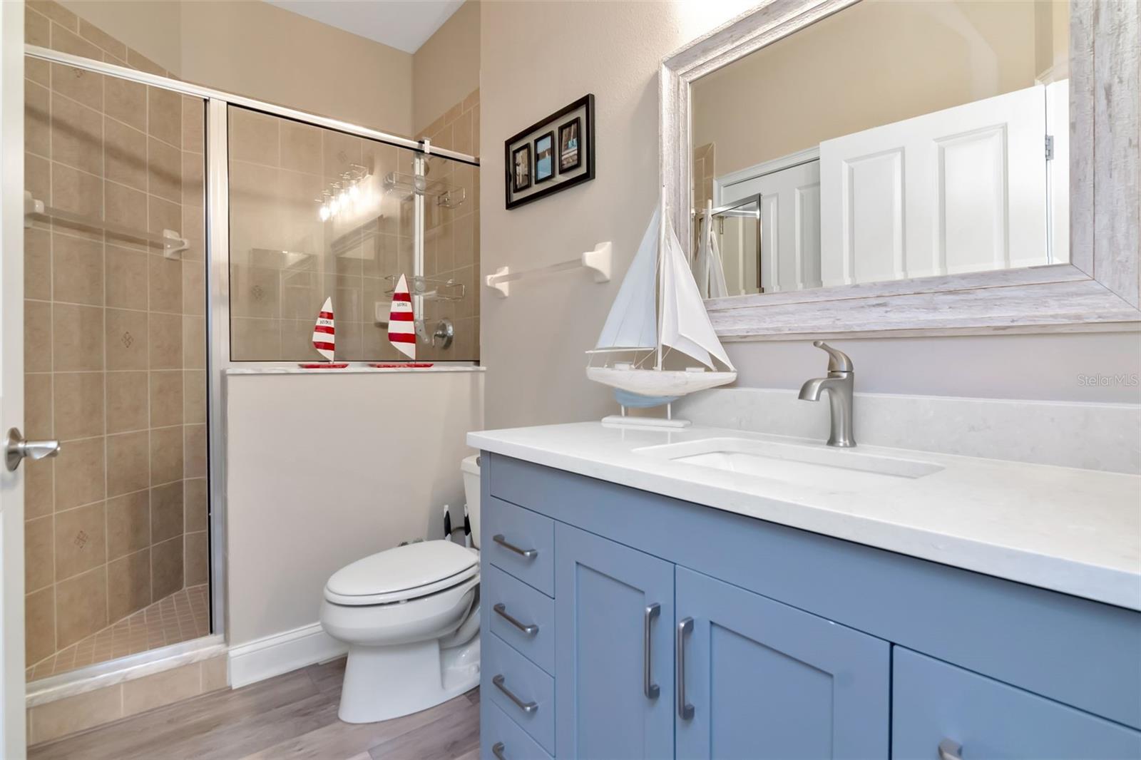 Main Level guest bath adjacent to the bed/office