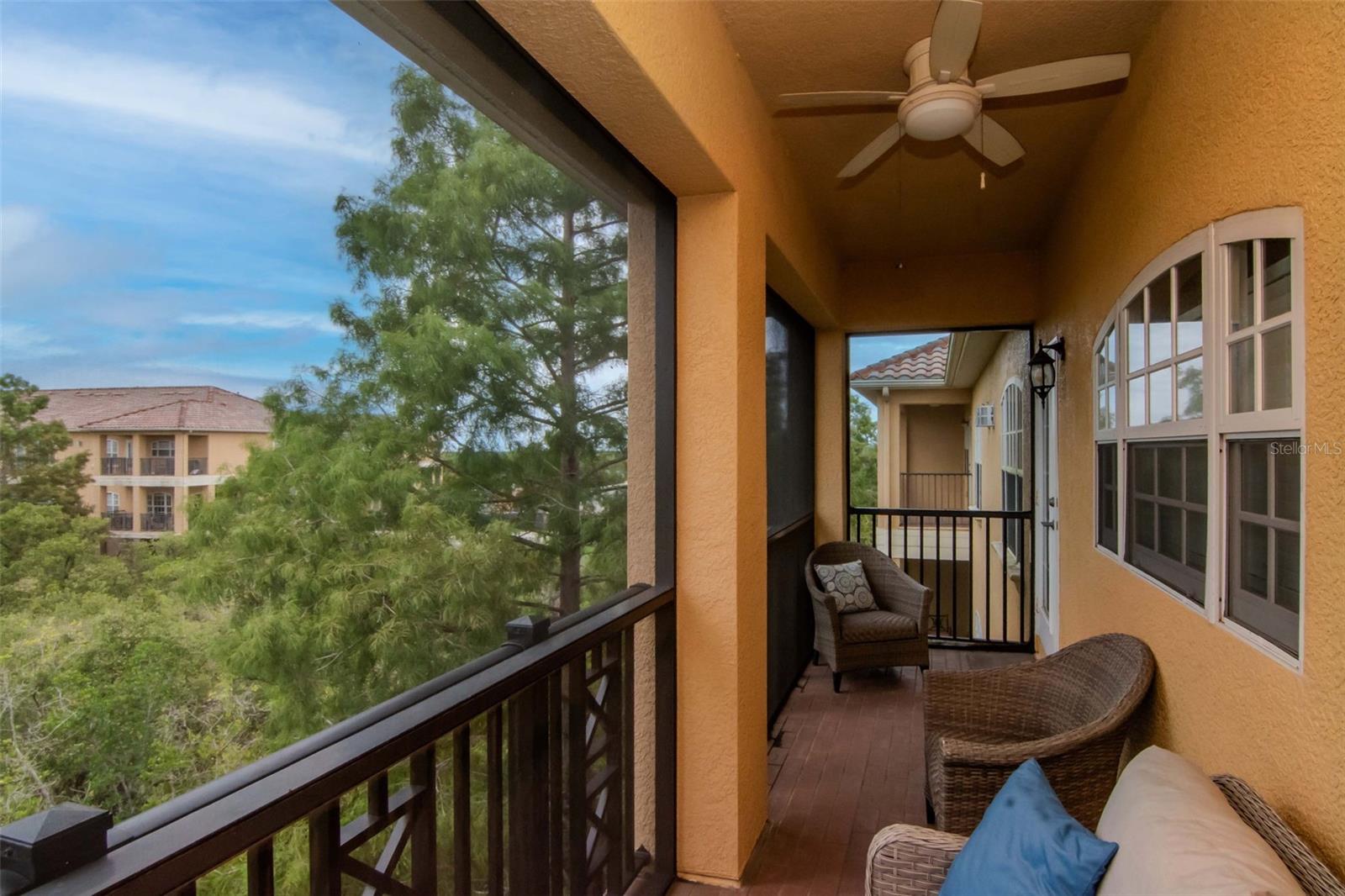 Primary Bedroom private screened in balcony