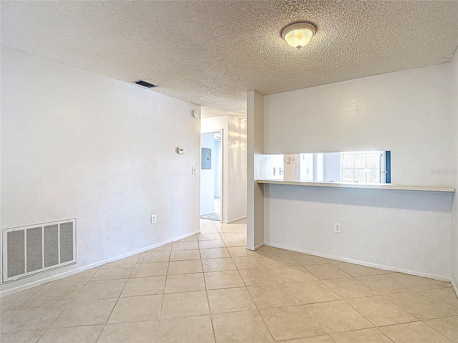 Pass through to dining area and entry hallway