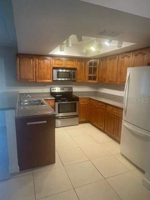 Light and bright open kitchen with plenty of cabinets and good lighting.