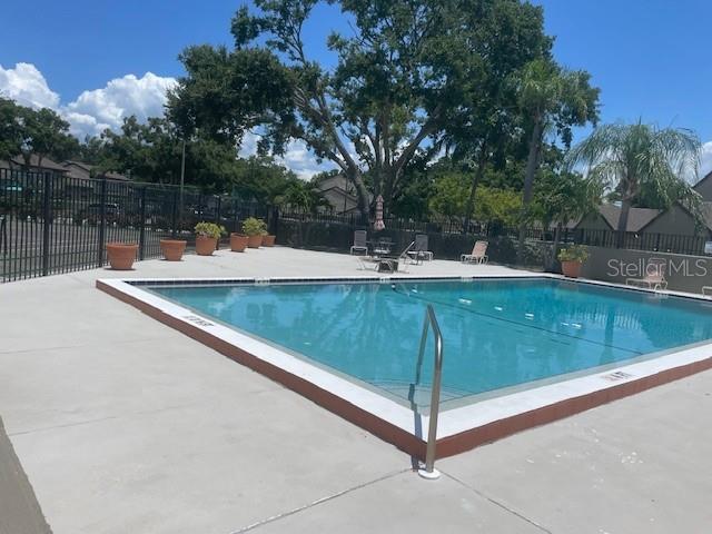 Community pool with inviting seating.