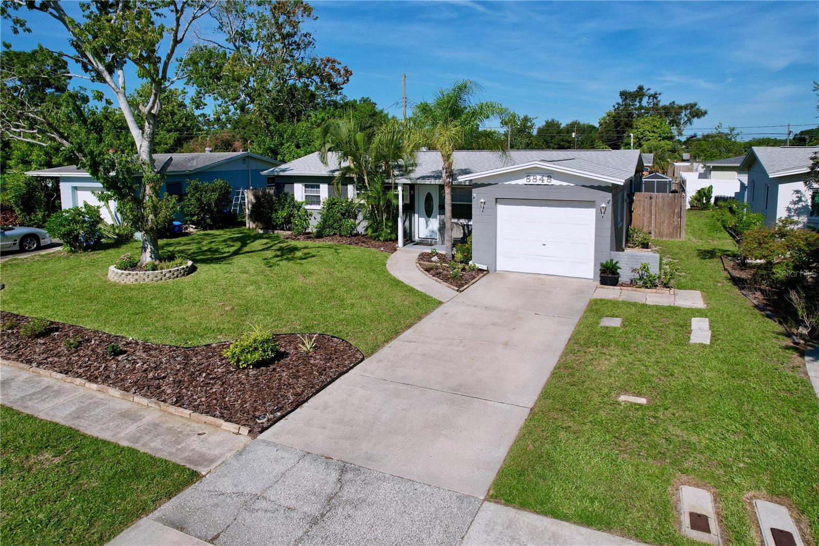 Great curb appeal with manicured lawn and reclaimed sprinkler system.