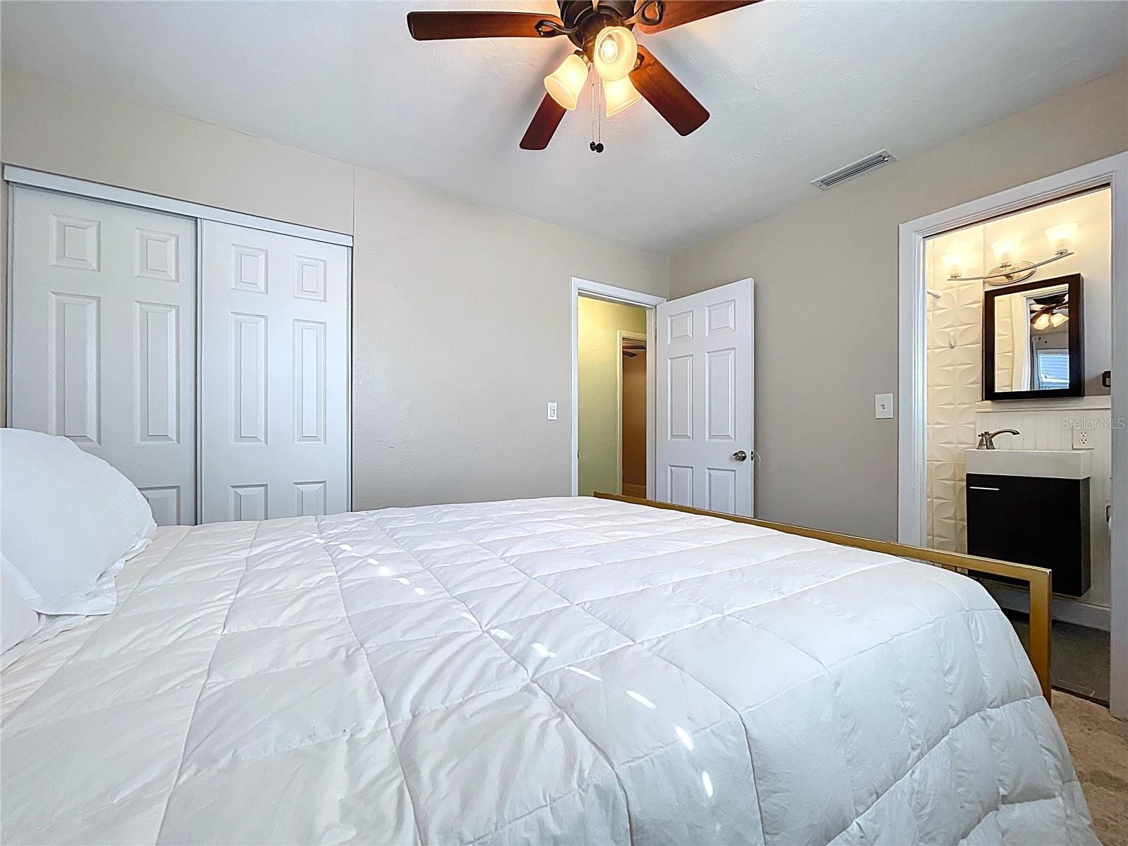 The primary bedroom offers an en-suite bathroom and plenty of natural light.