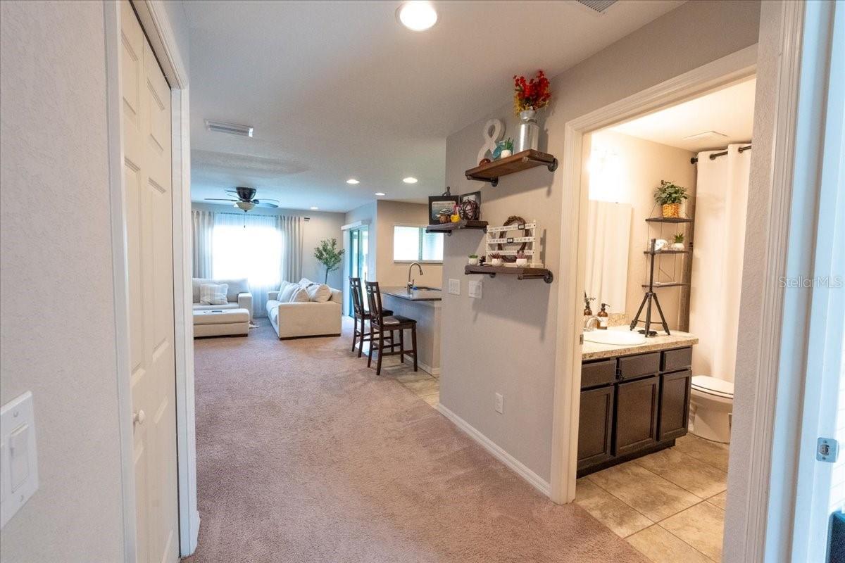 Downstairs entryway, bathroom, and living room