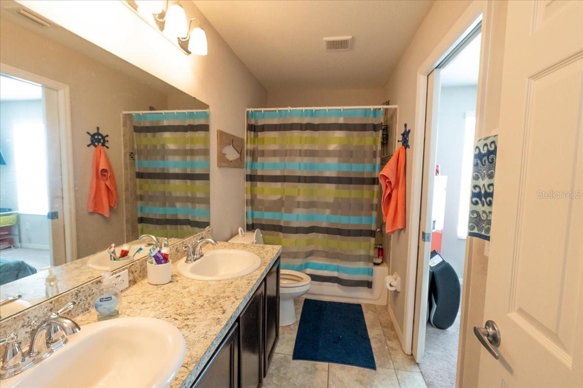 Bathroom connecting 2nd and 3rd bedrooms