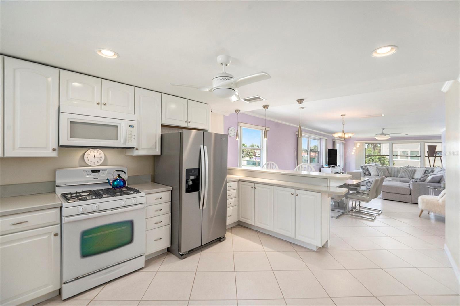 Open kitchen flows easily into the dining and living areas all with spectacular water views!