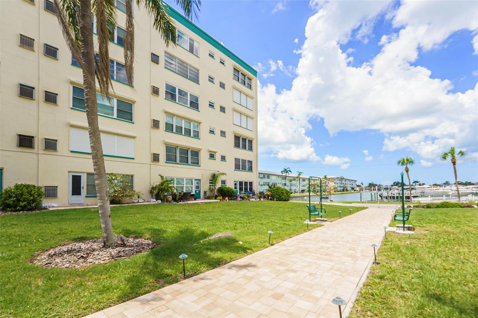 Jamison has a pavered path to the water views & pool area!