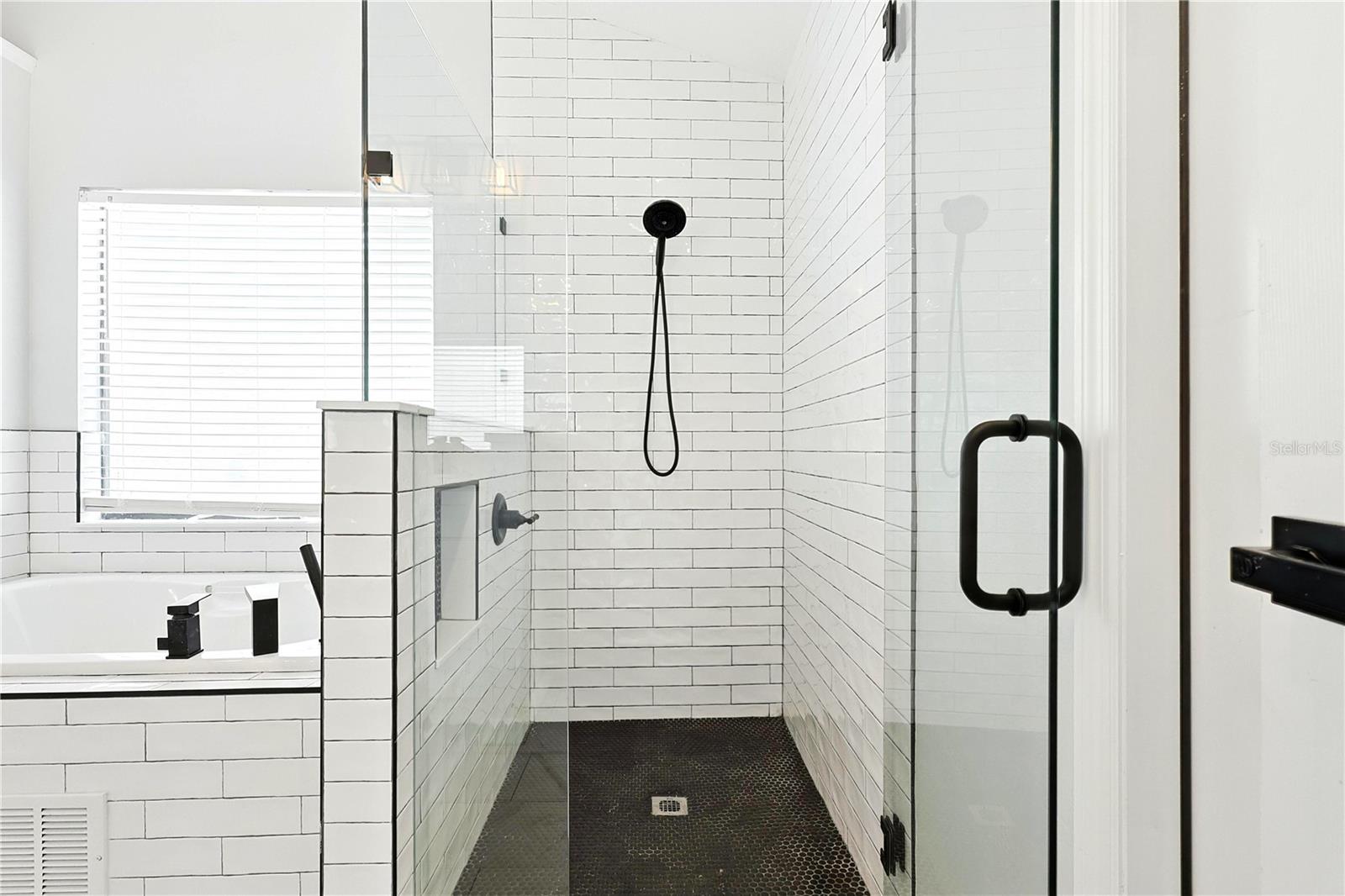 Primary bath, fully tiled walk-in
