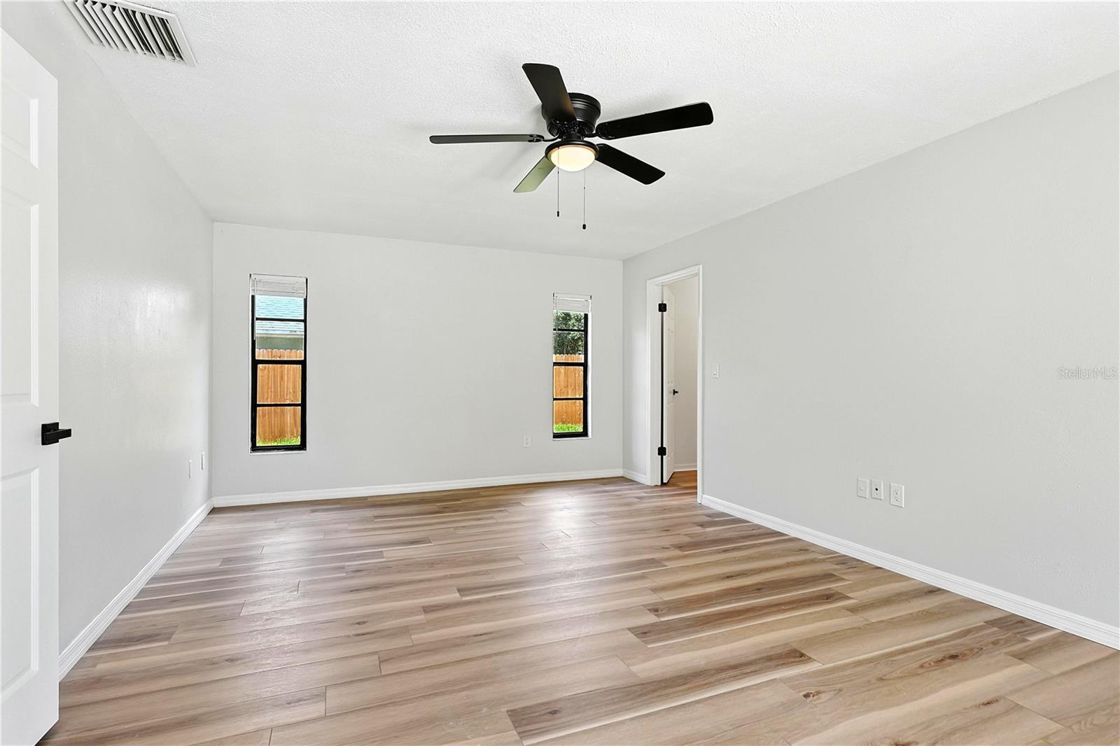 Primary bedroom with large walk-in closet—private pool access—