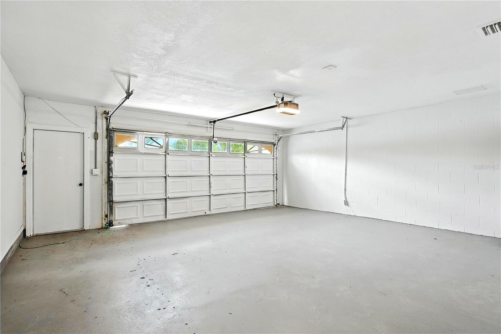 Large two car garage attached to house—new garage door opener—oversize 2 car garage with new garage door opener WiFi-Bluetooth