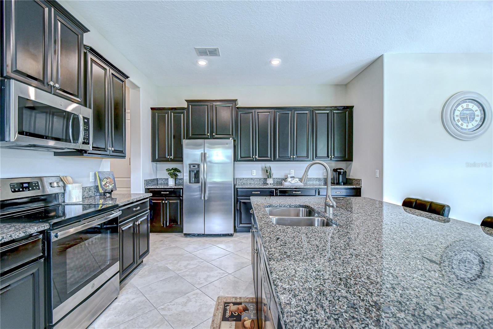 Beautiful granite countertops, 42" Espresso cabinets and sparkling stainless steel appliances.