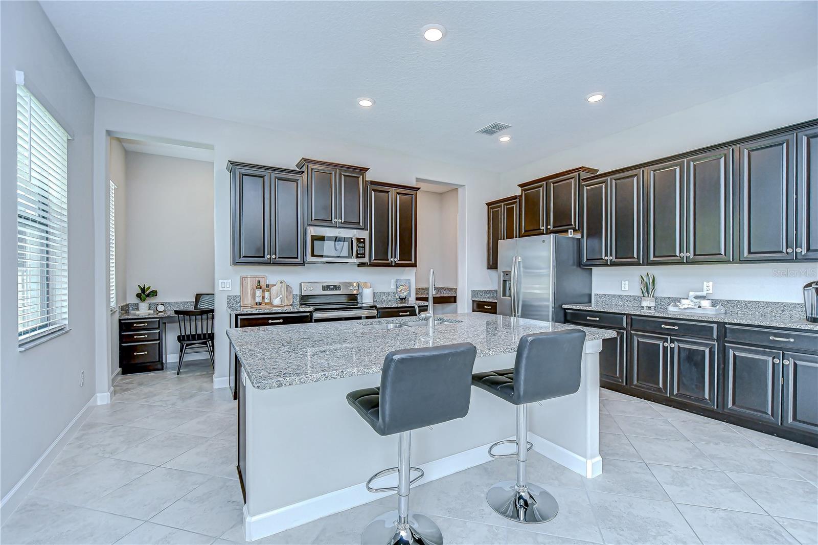 Kitchen Island with undermount sink and breakfast bar.