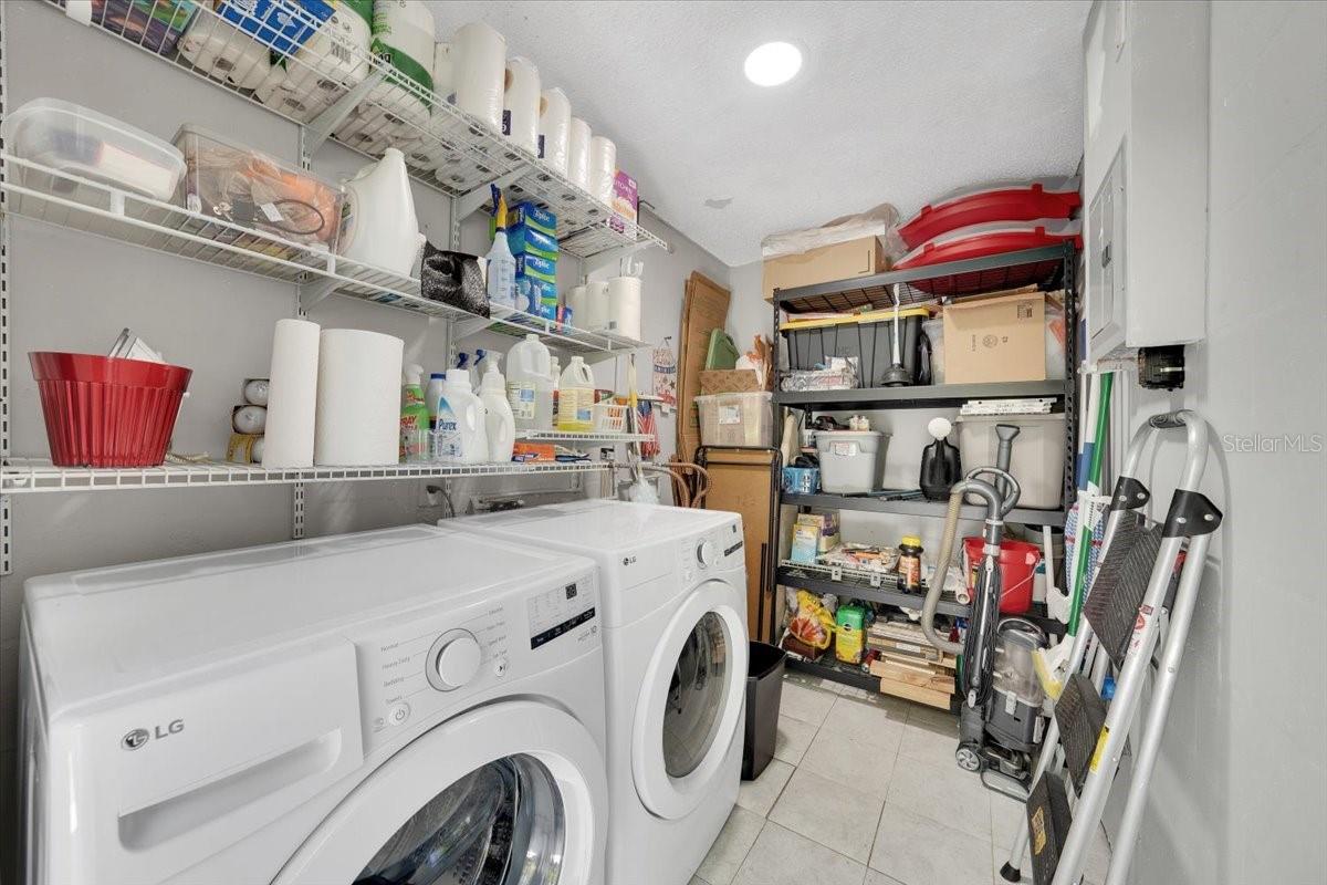 Laundry/storage off the enclosed lanai. Washer and dryer convey.
