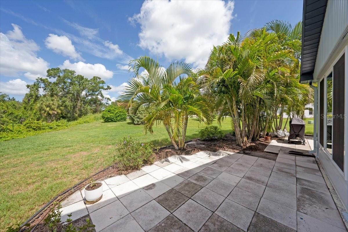 Paved exterior patio with a view